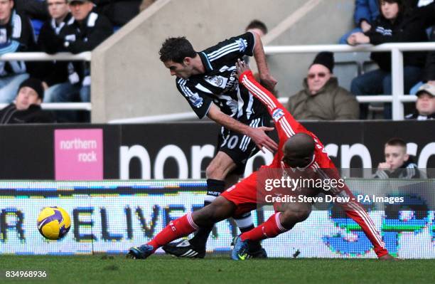 Newcastle United's David Edgar and Liverpool's Ryan Babel battle for the ball