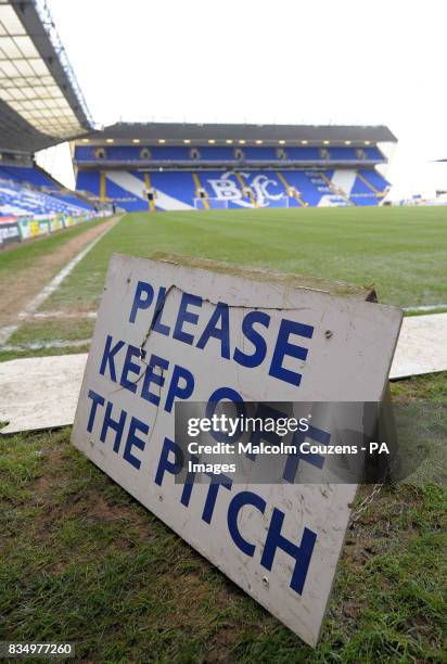 Keep off the grass" sign in front of the frozen pitch at St Andrews stadium, Birmingham.