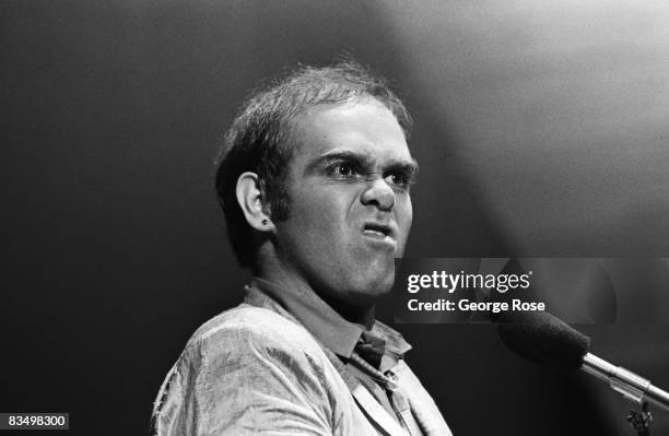 Grammy Award-winning pop singer and songwriter, Elton John, hams it up for the audience during a 1979 Universal City, California, concert at the...