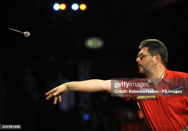 England's Martin Adams in action against Dave Chisnall during the World Darts Championship at Frimley Green, Surrey.