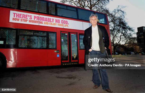 Professor Richard Dawkins next to a bus displaying an atheist message in Kensington Gardens, London.