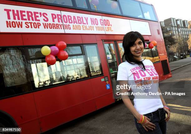 Guardian journalist Ariane Sherine poses beside a bus displaying an atheist message in Kensington Gardens, London. Brainchild of Ariane Sherine, the...