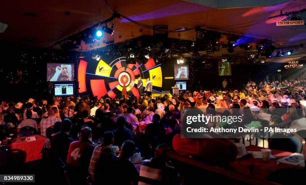 Darryl Fitton throws during the World Darts Championship at Frimley Green, Surrey.