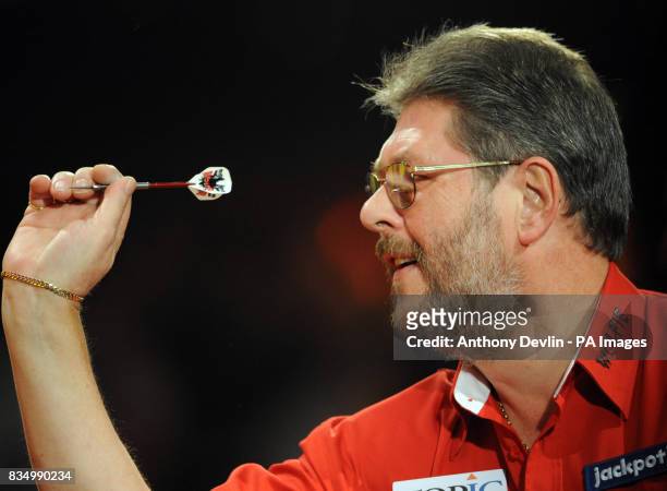 Martin Adams in action during the World Darts Championship at Frimley Green, Surrey.