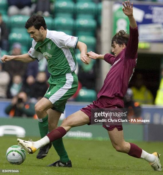 Hibernian's Ian Murray is tackled by Hearts' Deividas Cesnauskis during the Homecoming Scottish Cup match at Easter Road, Edinburgh.