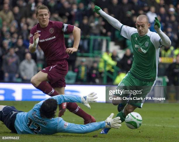 Hearts goalkeeper Janos Balogh stops Hibernian striker Steven Fletcher during the Homecoming Scottish Cup match at Easter Road, Edinburgh.