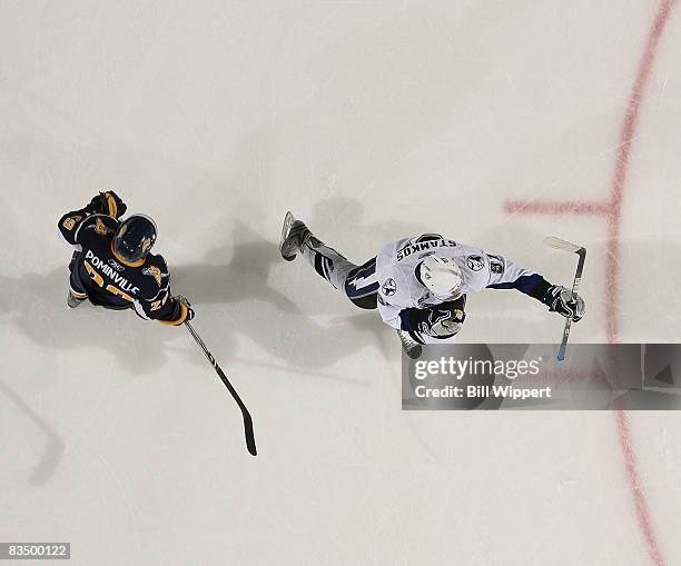 Steve Stamkos of the Tampa Bay Lightning celebrates his first career goal as Jason Pominville of the Buffalo Sabres watches on October 30, 2008 at...