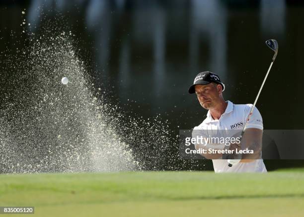 Henrik Stenson of Sweden hits a shot from the sand on the 15th hole during the second round of the Wyndham Championship at Sedgefield Country Club on...
