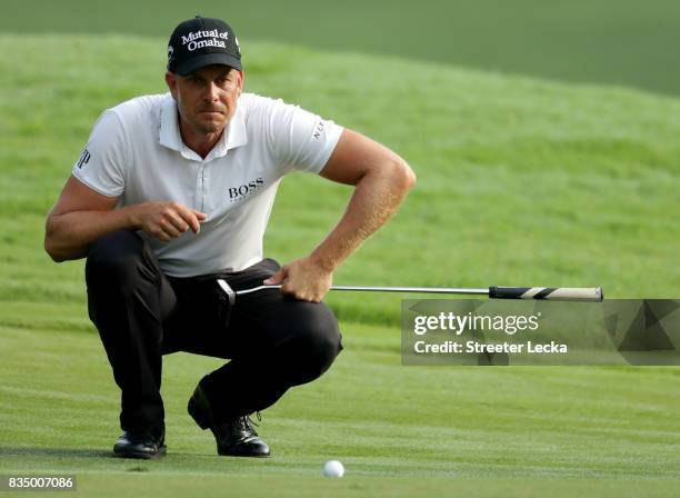 Henrik Stenson of Sweden lines up a putt on the 11th during the second round of the Wyndham Championship at Sedgefield Country Club on August 18,...