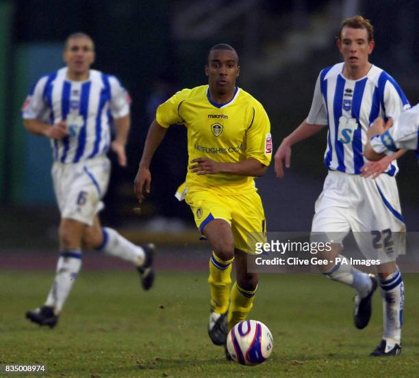 Leeds United's Fabian Delph dribbles through the Brighton defence during the Coca-Cola Football League One match at the Withdean Stadium, Brighton.