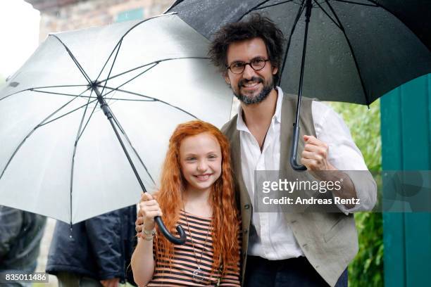 Malu Leicher and Tom Beck pose for photographs during a set visit of 'Liliane Susewind' on August 18, 2017 in Schleiden, Germany.