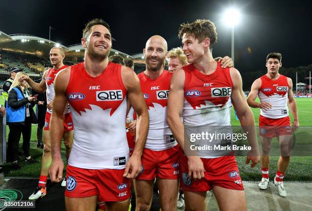 Josh Kennedy, Jarrad McVeigh and Dane Rampe of the Swans leave the ground after round 22 AFL match between the Adelaide Crows and the Sydney Swans at...
