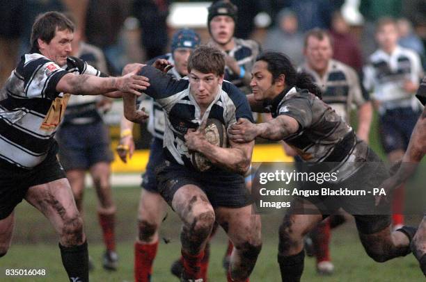 Musselburgh's Richard Simms is tackled by Kelso's Mee Kaa Eel Hartley and Garret Walsh during the Scottish Hydro Electirc Premiership Divison Two...