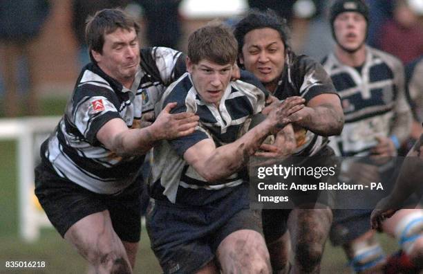 Musselburgh's Richard Simms is tackled by Kelso's Mee Kaa Eel Hartley and Garret Walsh during the Scottish Hydro Electirc Premiership Divison Two...