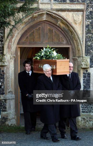 The coffin of Sir Dai Llewellyn leaves St Marys Church, Coddenham, Suffolk.