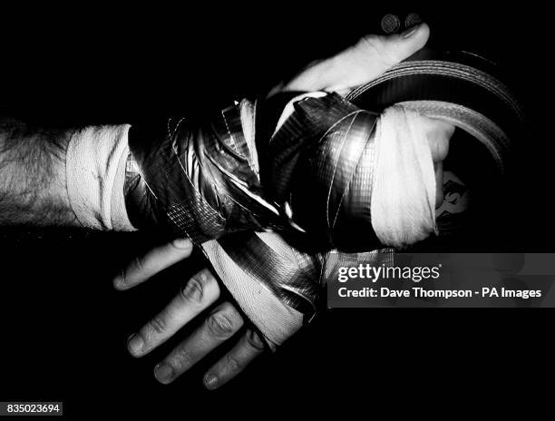 Boxer Steve Bell tapes up his hands during a training session at the former WBU Middleweight Champion Anthony Farnell's, Arnies Gym in Manchester.