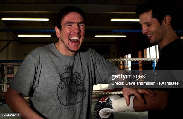 Trainer Anthony Farnell enjoys a light moment with boxer Steve Bell during a training session at the former WBU Middleweight Champion Farnell's,...