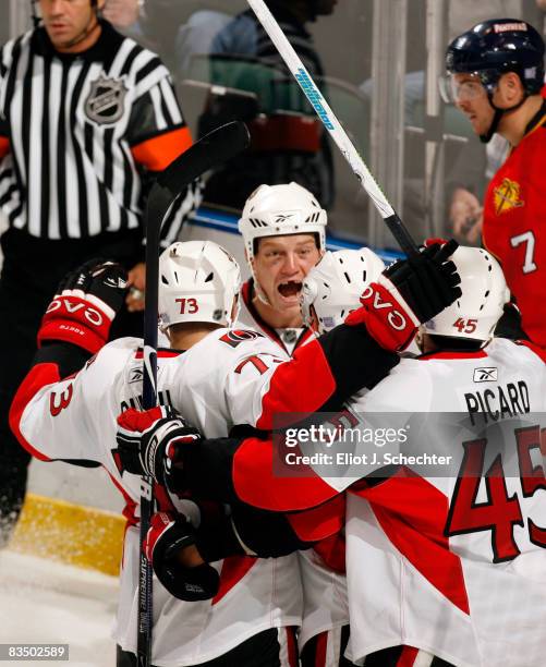 The Ottawa Senators celebrate a goal scored by teammate Chris Kelly against the Florida Panthers at the BankAtlantic Center October 30, 2008 in...