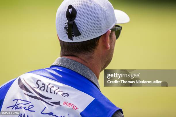 Caddie wearing a black ribbon for the victims of the terror attack in Spain is seen during day two of the Saltire Energy Paul Lawrie Matchplay at...