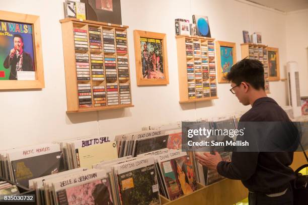 Man searching for records at RAGE, Record Art Game Emporium, on 04th April 2017 in Dublin, Republic of Ireland. RAGE is an independent record shop,...