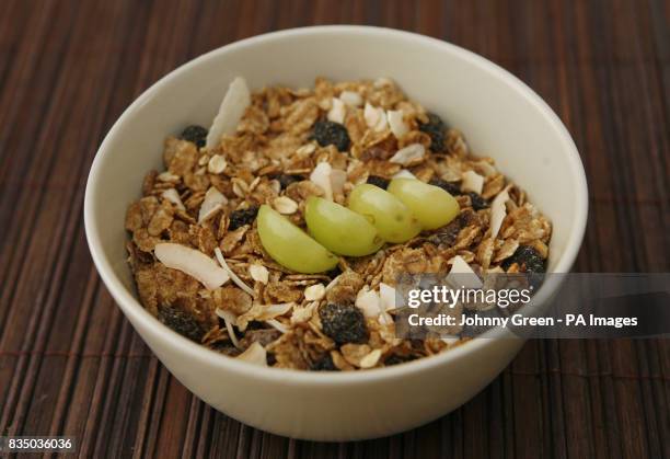 Bowl of Dorset super high fibre cereal with some sliced grapes added as a topping.