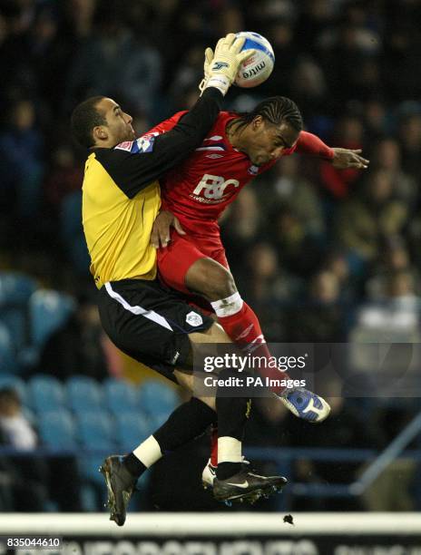 Sheffield Wednesday's goalkeeper Lee Grant claims the ball ahead of Birmingham City's Cameron Jerome