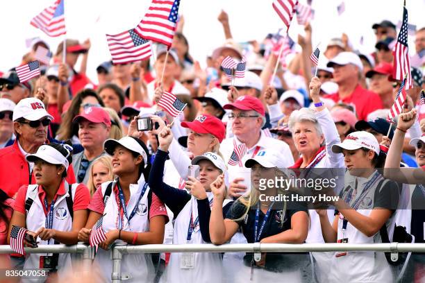 American fans cheer on the first tee during the morning foursomes matches of the Solheim Cup at the Des Moines Golf and Country Club on August 18,...