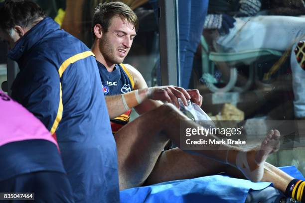 Daniel Talia of the Crows after injuring his ankle during the round 22 AFL match between the Adelaide Crows and the Sydney Swans at Adelaide Oval on...