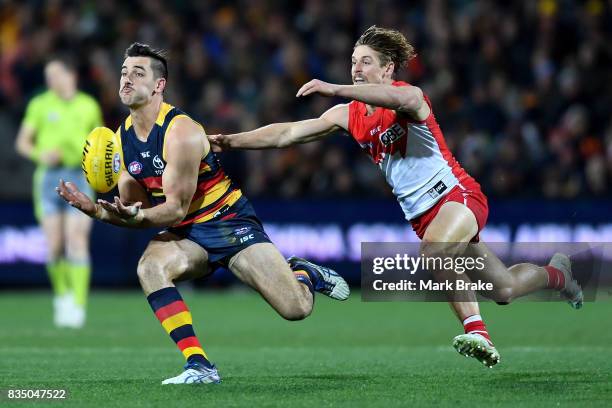 Taylor Walker of the Crows marks in front of Dane Rampe of the Swans during the round 22 AFL match between the Adelaide Crows and the Sydney Swans at...