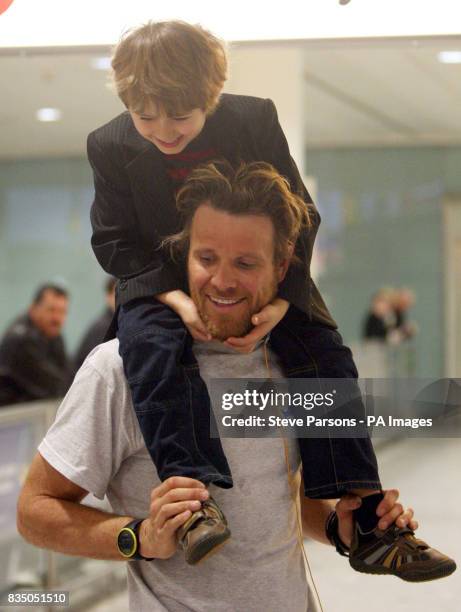 James Cracknell is met by son Croyde at Heathrow Airport, Terminal 3, after he and Ben Fogle return from racing in the Amundsen Omega 3 South Pole...