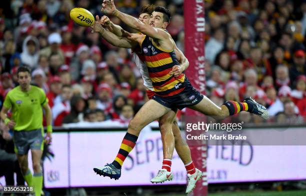 Taylor Walker of the Crows Dane Rampe of the Swans competes during the round 22 AFL match between the Adelaide Crows and the Sydney Swans at Adelaide...
