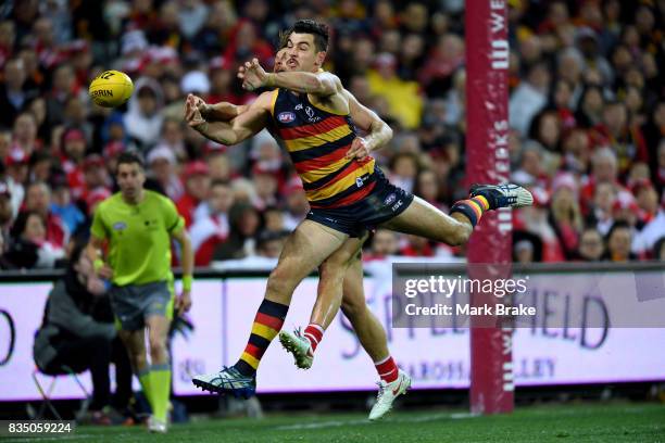 Taylor Walker of the Crows and Dane Rampe of the Swans competes during the round 22 AFL match between the Adelaide Crows and the Sydney Swans at...