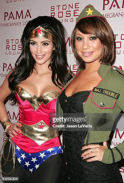 Personalities Kim Kardashian and Cheryl Burke attend Kim Kardashian's Halloween Masquerade at Stone Rose on October 30, 2008 in Los Angeles,...