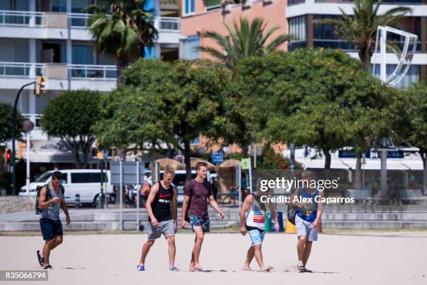 Tourist enter the beach next to the spot where five terrorists were shot by police on August 18, 2017 in Cambrils, Spain. Fourteen people were killed...