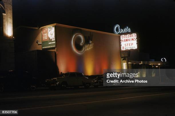 The exterior of Ciro's nightclub on the Sunset Strip at night, West Hollywood, California, circa 1955. Dolores Hawkins and the Step Brothers are...