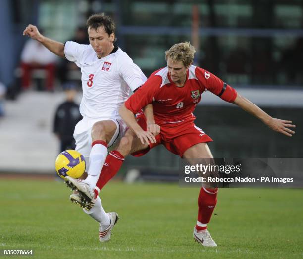 Wales' David Edwards in action with Poland's Jakub Wawrzyniak during the International Friendly at the Vila Real De Santo Antonio Sports Complex,...