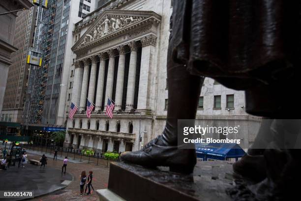 Statue of George Washington stands across from the New York Stock Exchange in New York, U.S., on Friday, Aug. 18, 2017. Stocks were mixed and the S&P...