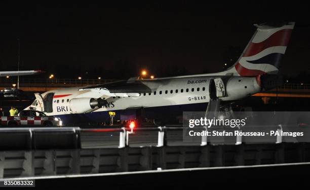 The British Airways Avro RJ100 aircraft, on the runway after crash landing at London City Airport tonight.