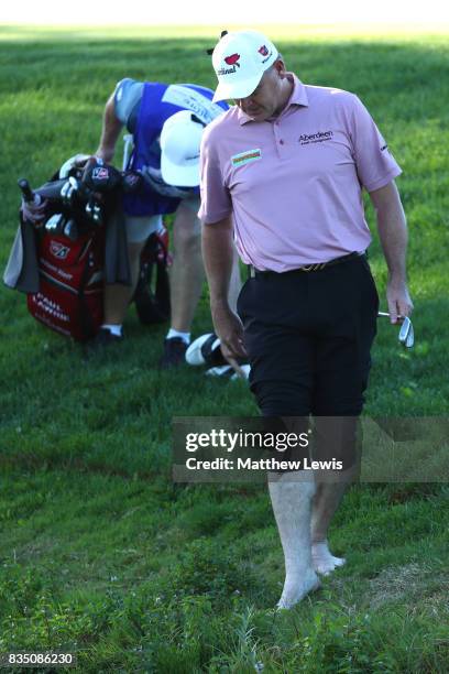 Paul Lawrie of Scotland prepares to hit his second shot on the 17th hole from the water during the 32 qualifiers matches of the Saltire Energy Paul...