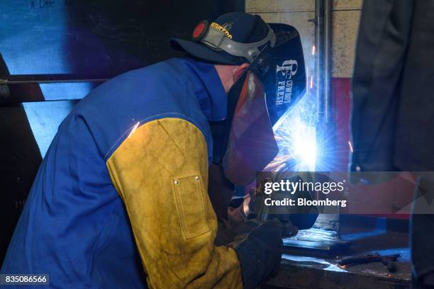 An instructor demonstrates MIG welding techniques during a class at the Penn Commercial Business/Technical School in Washington, Pennsylvania, U.S.,...