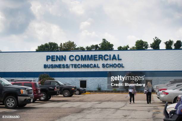 Students walk towards an entrance to Penn Commercial Business/Technical School in Washington, Pennsylvania, U.S., on Tuesday, Aug. 15, 2017. While...