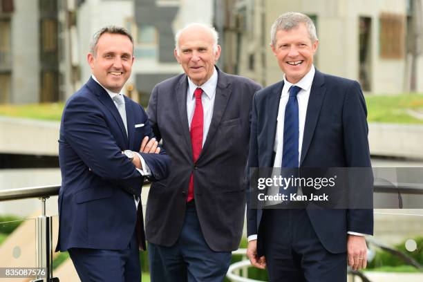 Liberal Democrat leader Vince Cable Scottish party leader Willie Rennie and Alex Cole-Hamilton MSP chat together after posing for photographs with...