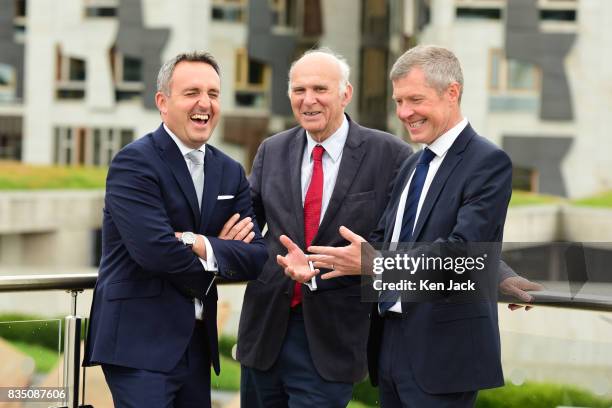 Liberal Democrat leader Vince Cable Scottish party leader Willie Rennie and Alex Cole-Hamilton MSP chat together after posing for photographs with...