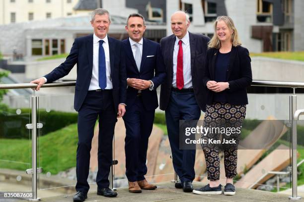 Liberal Democrat leader Vince Cable Scottish party leader Willie Rennie Alex Cole-Hamilton MSP and Councillor Hal Osler pose for photographs with the...