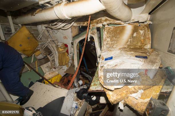 In this released U.S. Navy handout, The Arleigh Burke-class guided-missile destroyer USS Fitzgerald sits in Dry Dock 4 at Fleet Activities Yokosuka...