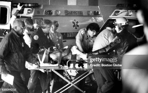 Boston Police patrolman Jeremiah J. Hurley arrives at Brigham and Women's Hospital after being injured in an explosion in Roslindale on Oct. 28, 1991.