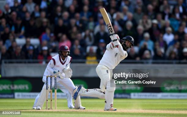 Moeen Ali of England hits out to be caught out by Kraigg Brathwaite of the West Indies during day two of the 1st Investec Test match between England...
