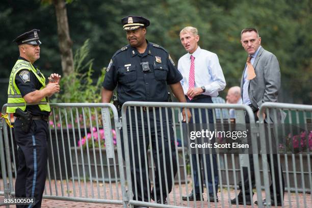 Boston Police Chief William Gross, second from left, Boston Police Commissioner William Evans, second from right, with other officers along...