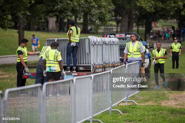 Workers set up barricades on the Boston Common where a "Free Speech" rally is scheduled and a large rally against hate In solidarity with victims of...