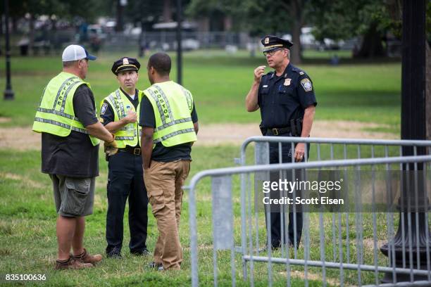 Police officials coordinate where to put barricades on the Boston Common where a "Free Speech" rally is scheduled and a large rally against hate in...